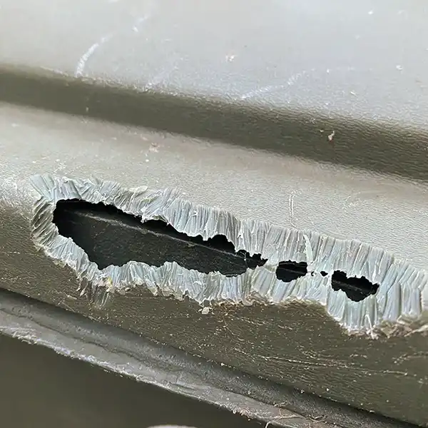 Damaged garbage can